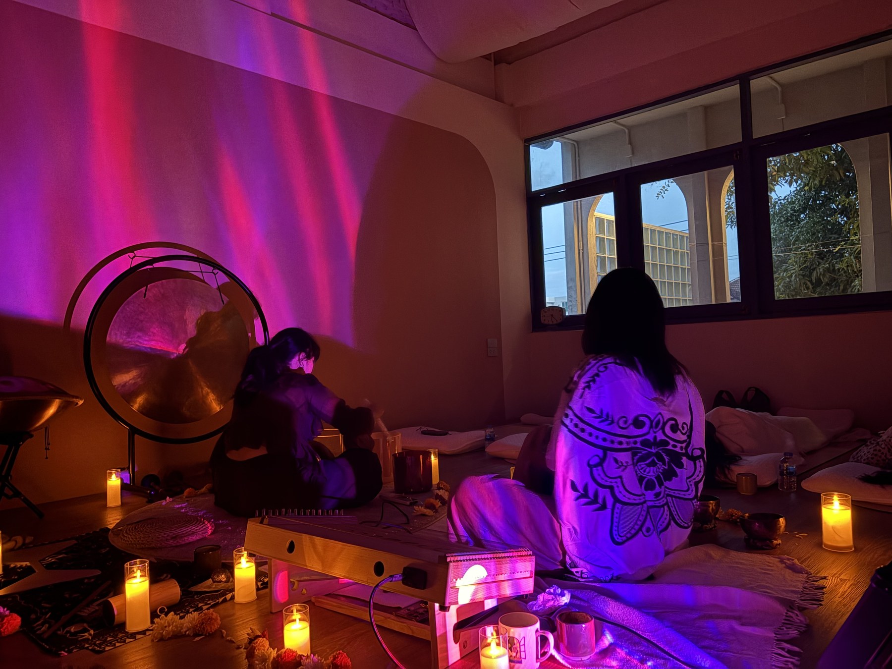 Guests and facilitators sharing a sound healing session at Soulwaves
