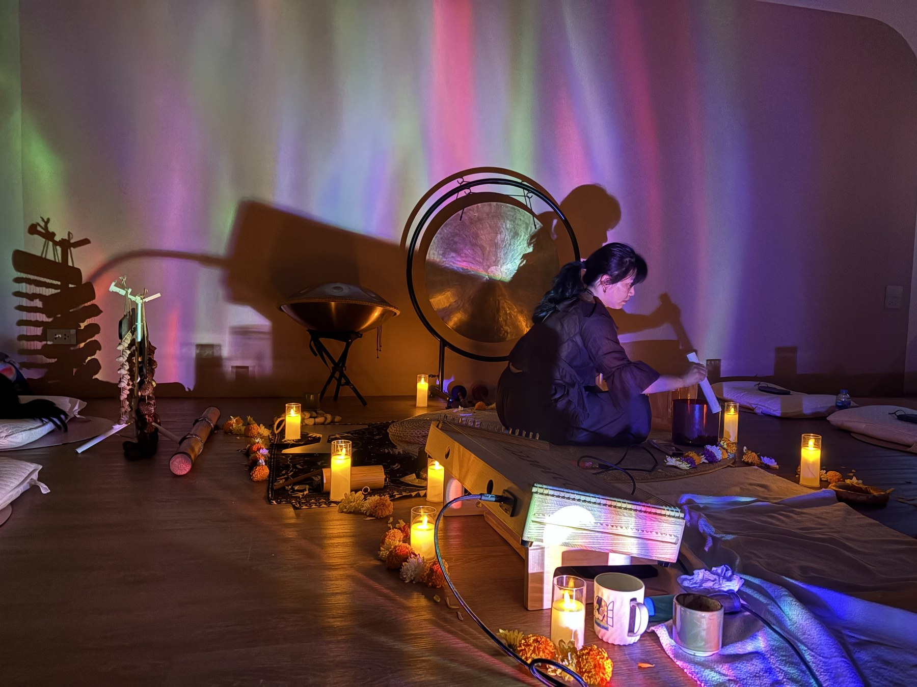 Facilitator preparing sound healing instruments