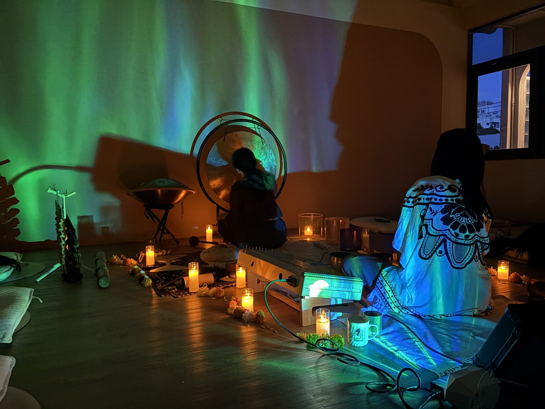 Participants relaxing during a colorful sound bath