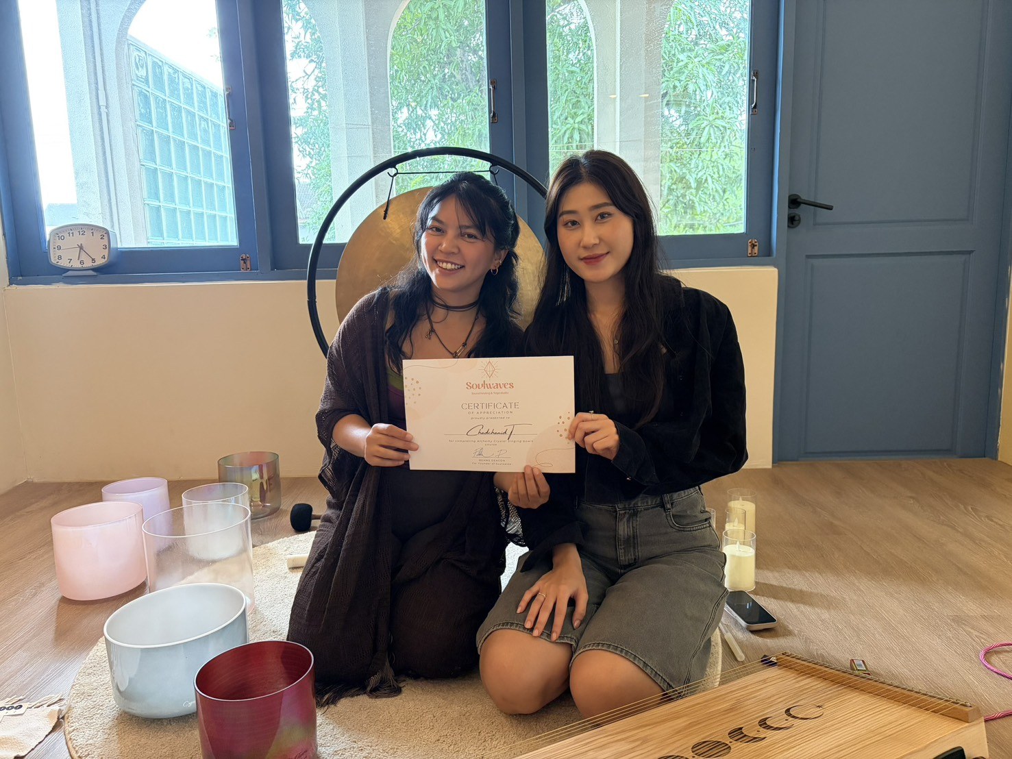 Sound healing student celebrating a training certificate