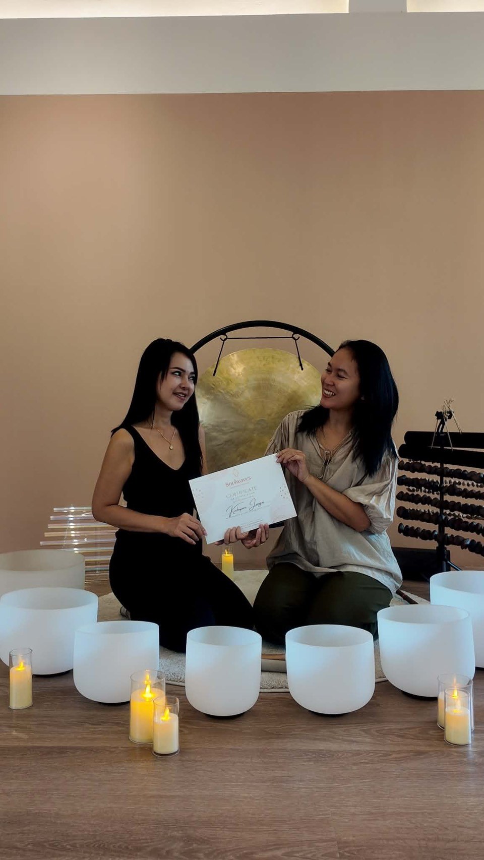 Sound healing practitioner and student with a certificate
